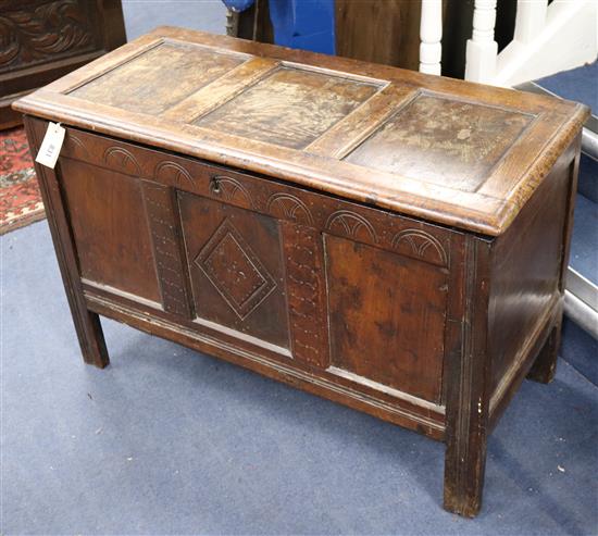 An 18th century carved oak coffer W.87cm